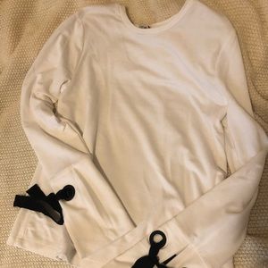 White sweater with ribbons